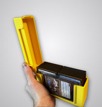 Yellow Commander deck box open, holding 100 sleeved Magic: The Gathering cards