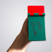 Miles Morales Commander deck box, red and green, hinge end with Miles Morales lettering, digital file preview